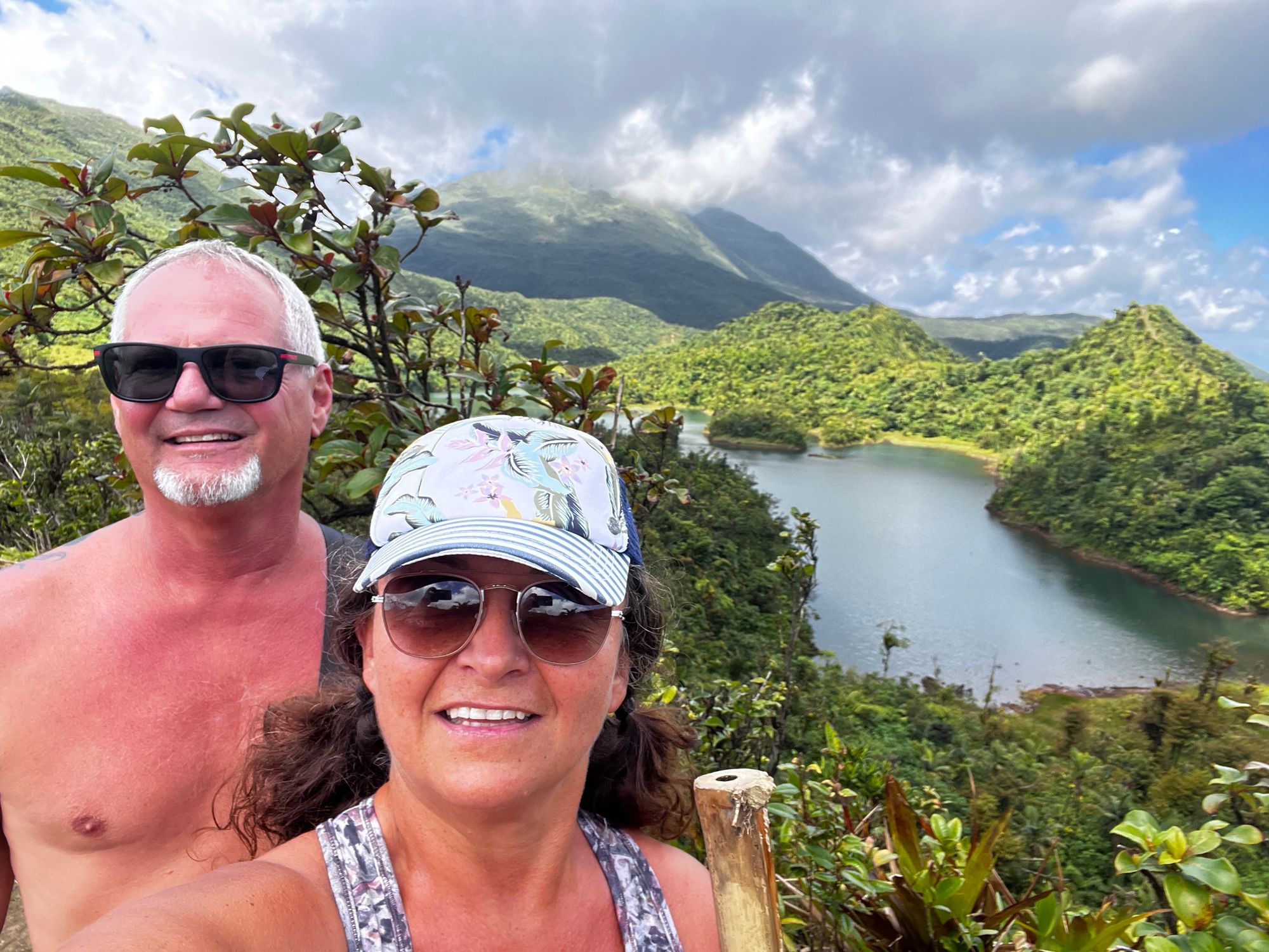 Couple hiking vacation activities in the Caribbean jungle