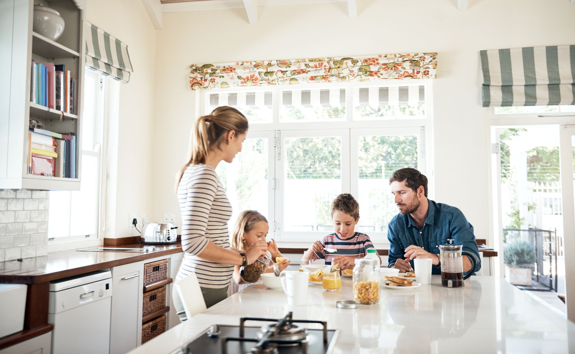 Family eating in kitchen on HomeExchange vacation