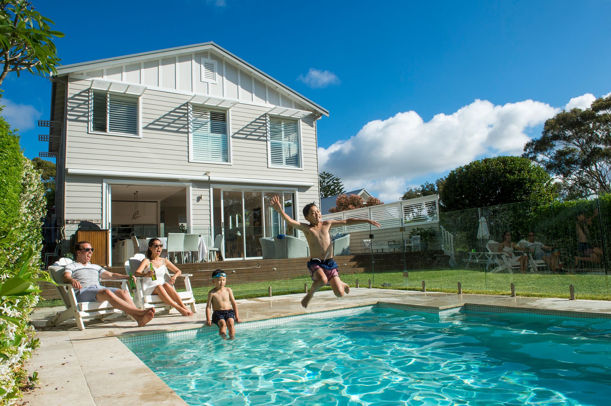 Kids-jumping-in-pool-at-HomeExchange-home