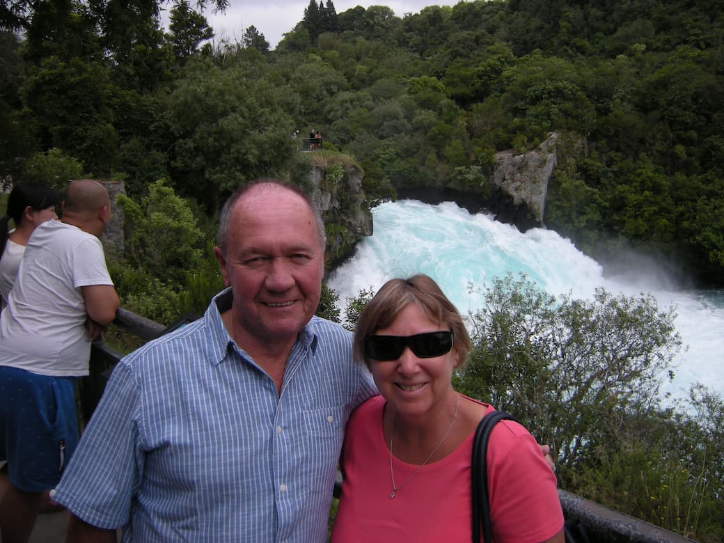 Lady in pink t-shirt with man in striped blue shirt at the rapids in New Zealand_HomeExchange