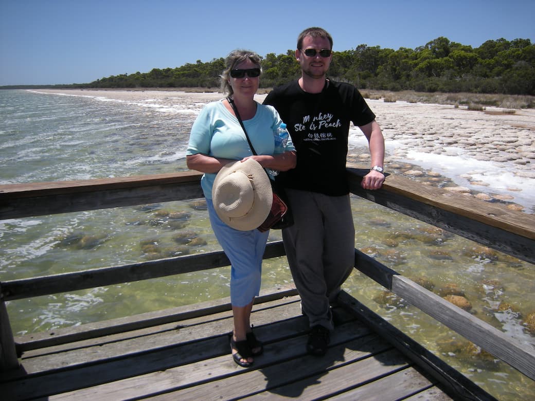 Lady and her son wearing sunglasses on decking overlooking Lake Clifton in Australia_HomeExchange