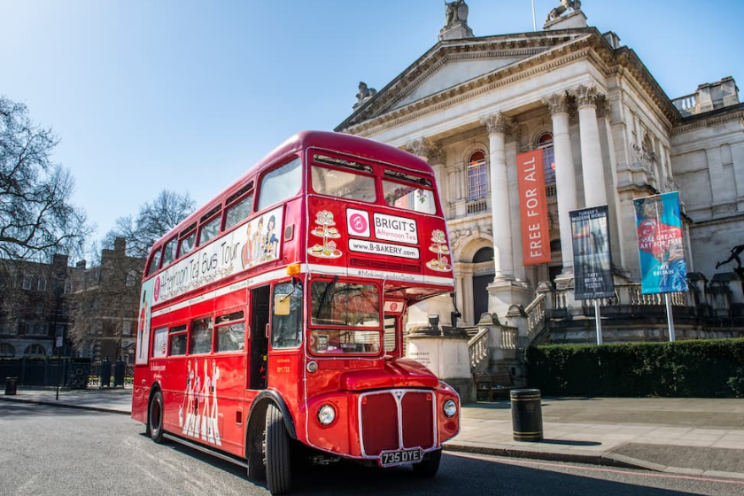 Old fashioned red London Bus outside Tate Britain - things to do on a rainy day in London