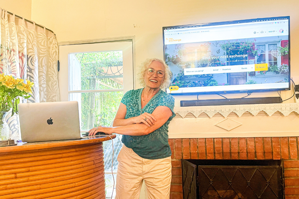 HomeExchange member with laptop