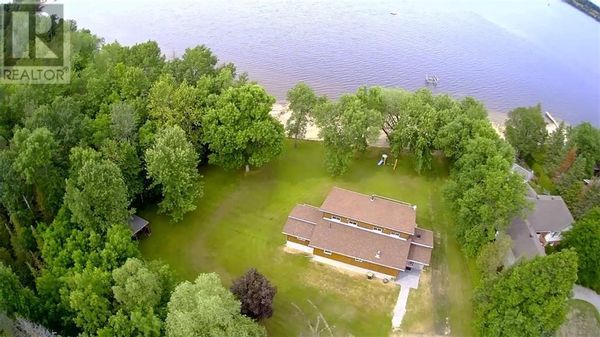 Beautiful waterfront home on a large private lot. Step out your door to walking trails, snowmobile and cross country ski trails in the winter. Skate on the frozen river. Warm up in the waterfront hot tub.