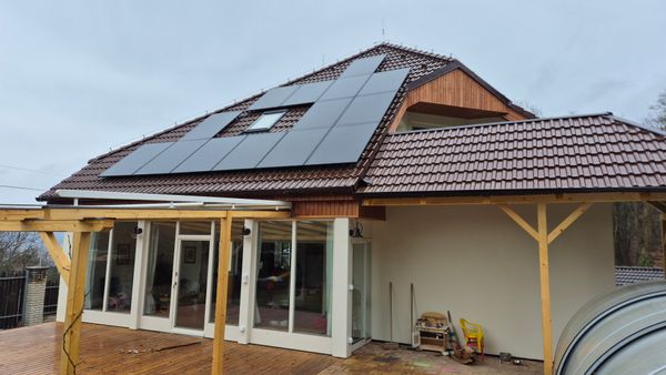 A family house between forrests, hills and a river