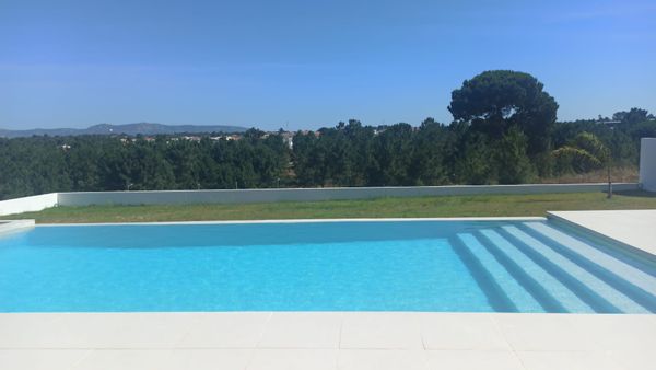A family home with a beautiful view with a pool